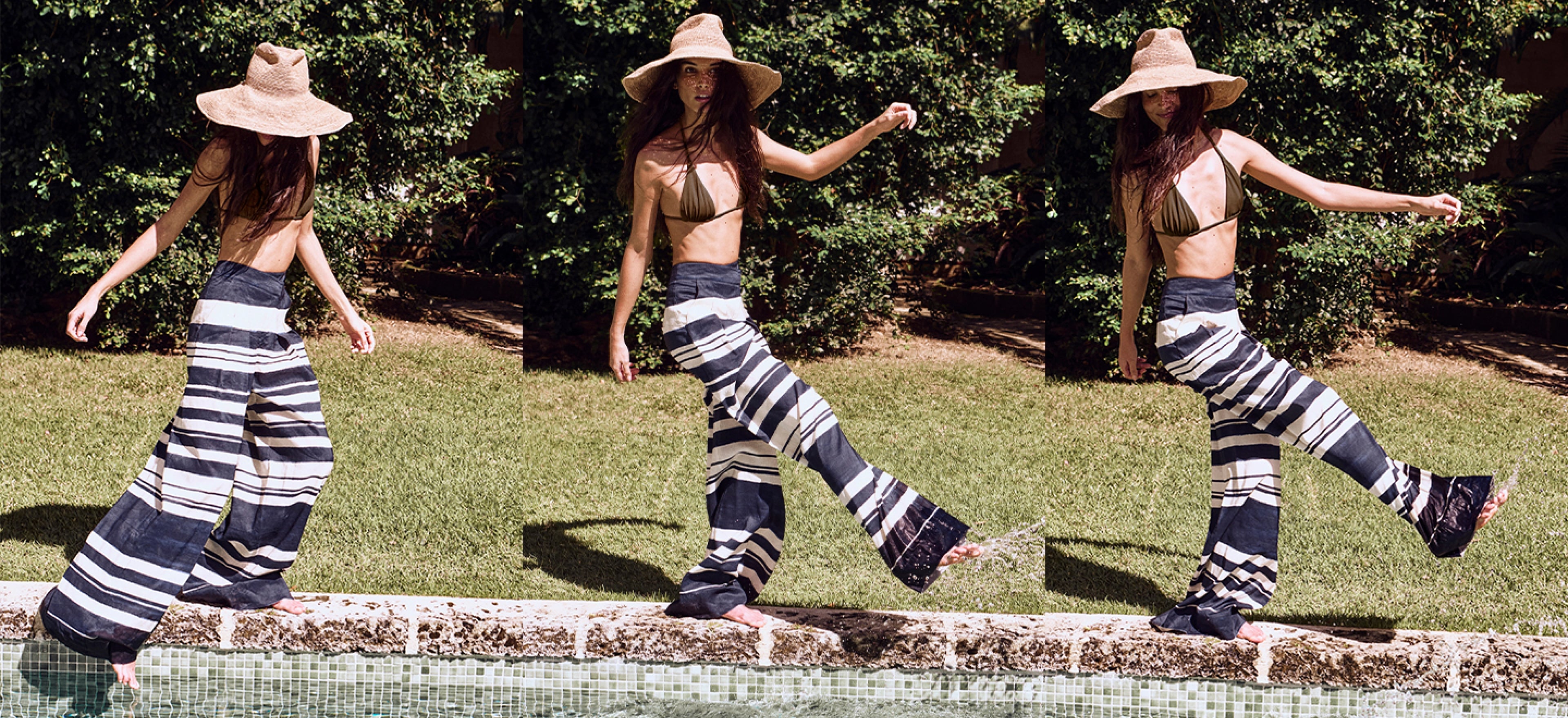 Three individuals wearing hooded capes and striped pants stand in a grassy outdoor setting with trees in the background.