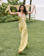 Veronica Beard Light green satin camisole with lace trim and matching wide-leg pleated trousers.