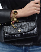 Veronica Beard Black crocodile embossed leather shoulder bag with gold clasp.