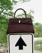 Veronica Beard Brown suede handbag with gold hardware and top handle.