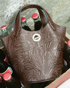 Veronica Beard Brown embossed leather bucket bag with silver hardware.