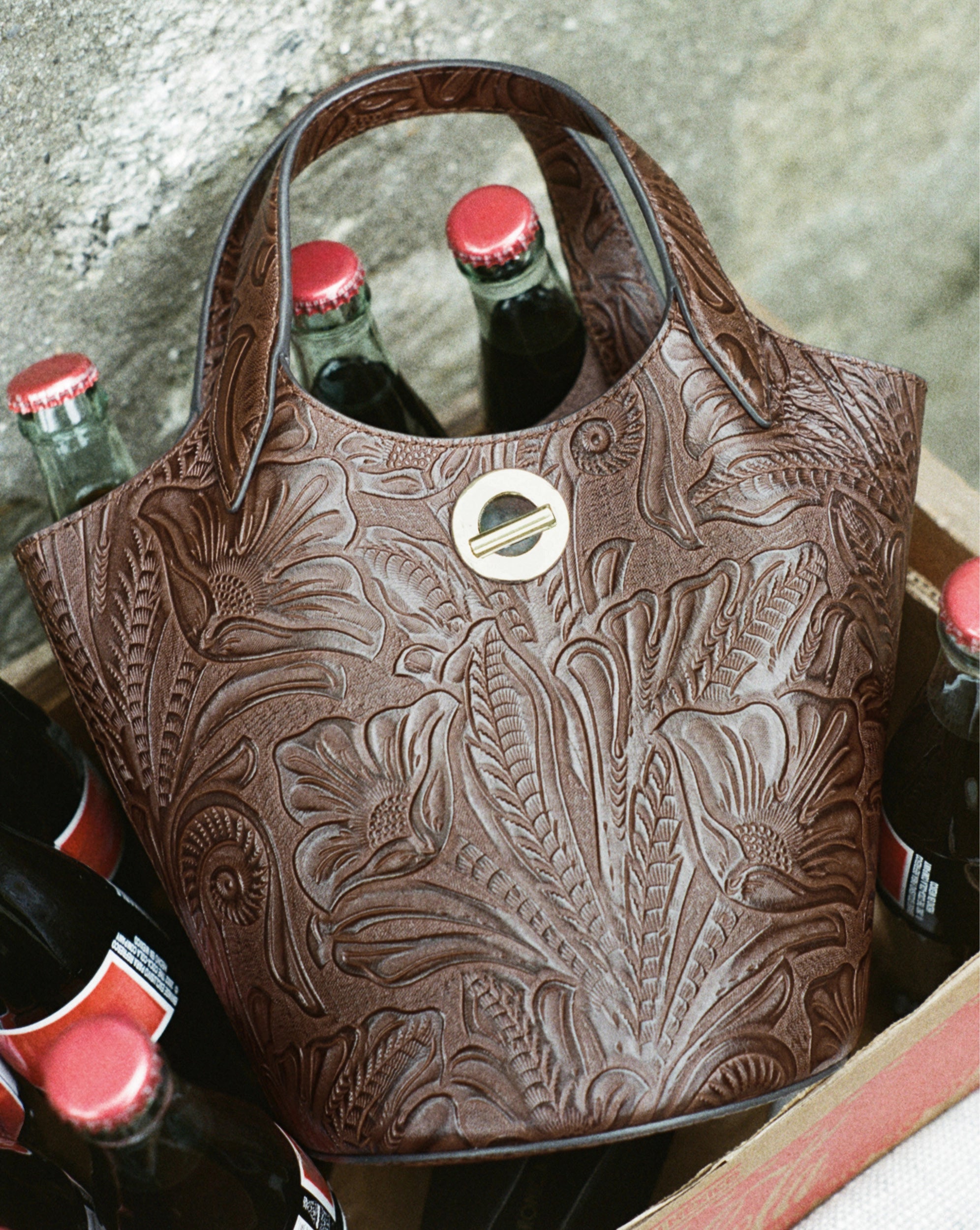 Veronica Beard Brown embossed leather bucket bag with silver hardware.
