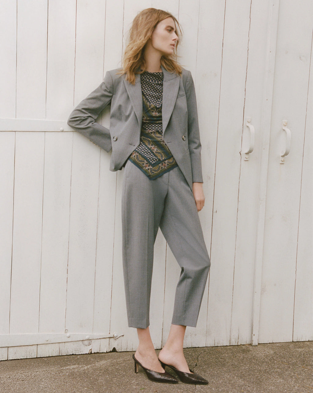 Veronica Beard Gray wool trousers, high-waisted, straight-leg, with single button closure.