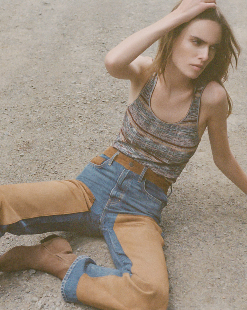Veronica Beard Dark wash flare jeans and a striped knit tank top.