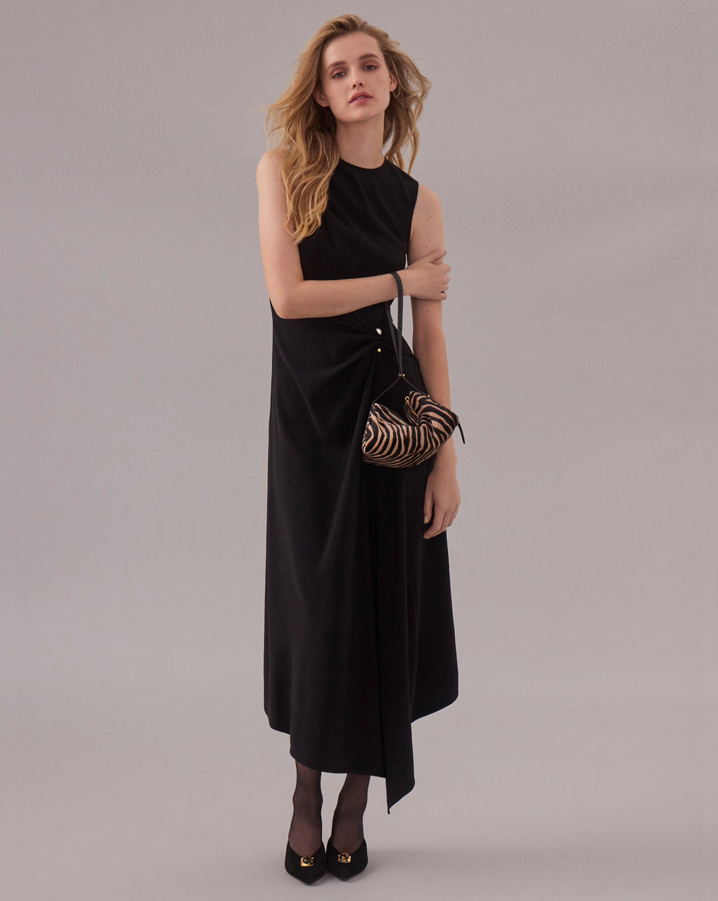 Veronica Beard Zebra print calf hair shoulder bag with gold zipper.