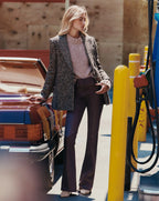 Veronica Beard Brown flare pants with coated denim finish.