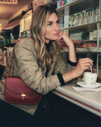 Veronica Beard Tan quilted jacket with black trim.