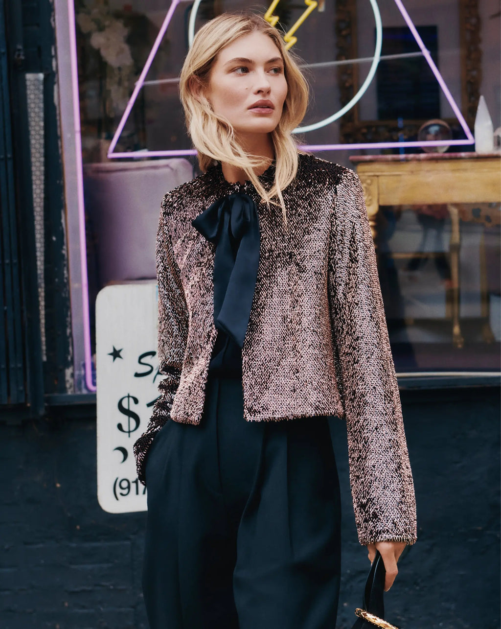 Veronica Beard Brown sequin cropped jacket and black trousers.