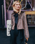 Veronica Beard Brown sequin cropped jacket and black trousers.