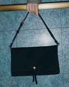 Veronica Beard Black suede shoulder bag with gold hardware.