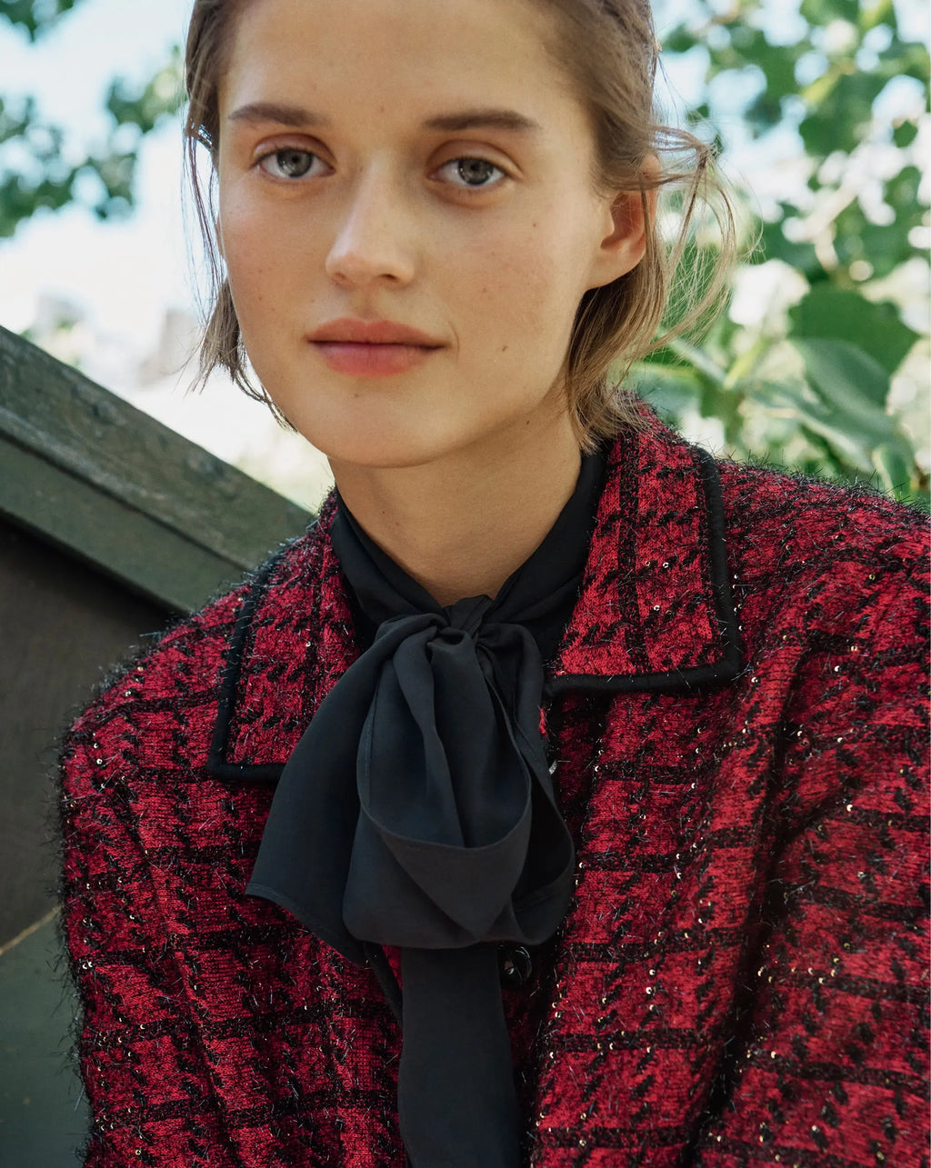 Veronica Beard Red tweed button-down jacket with black trim.
