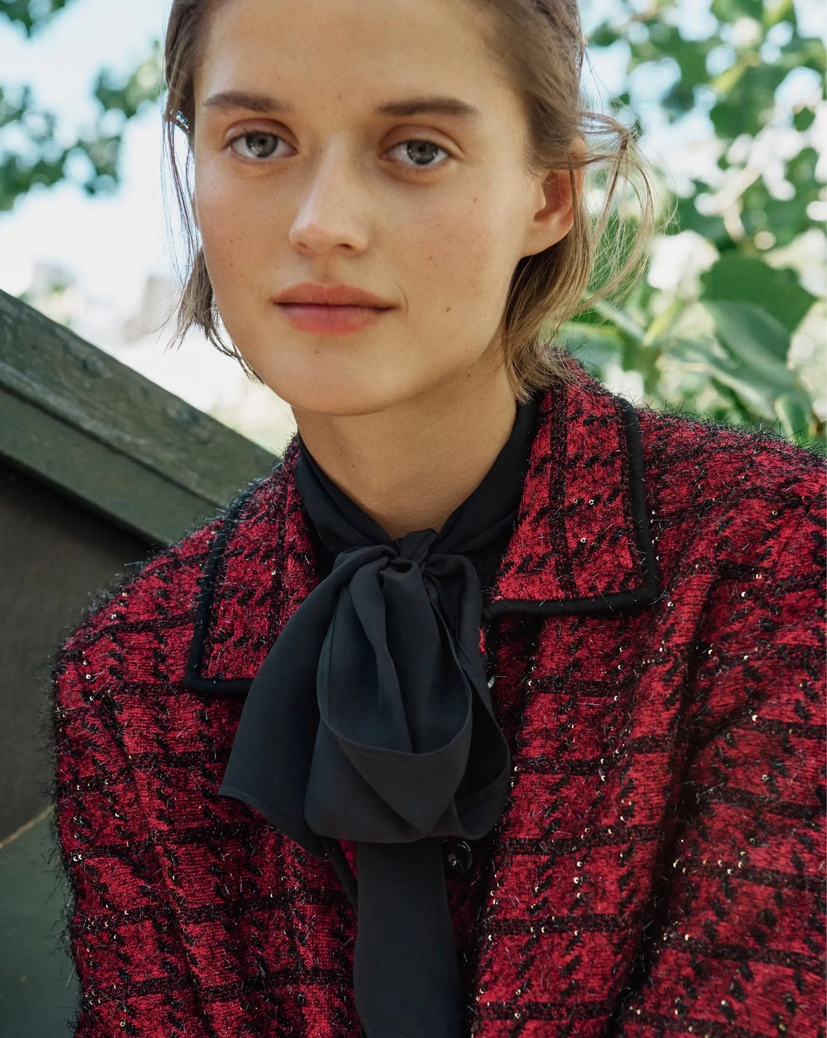 Veronica Beard Red tweed button-down jacket with black trim.