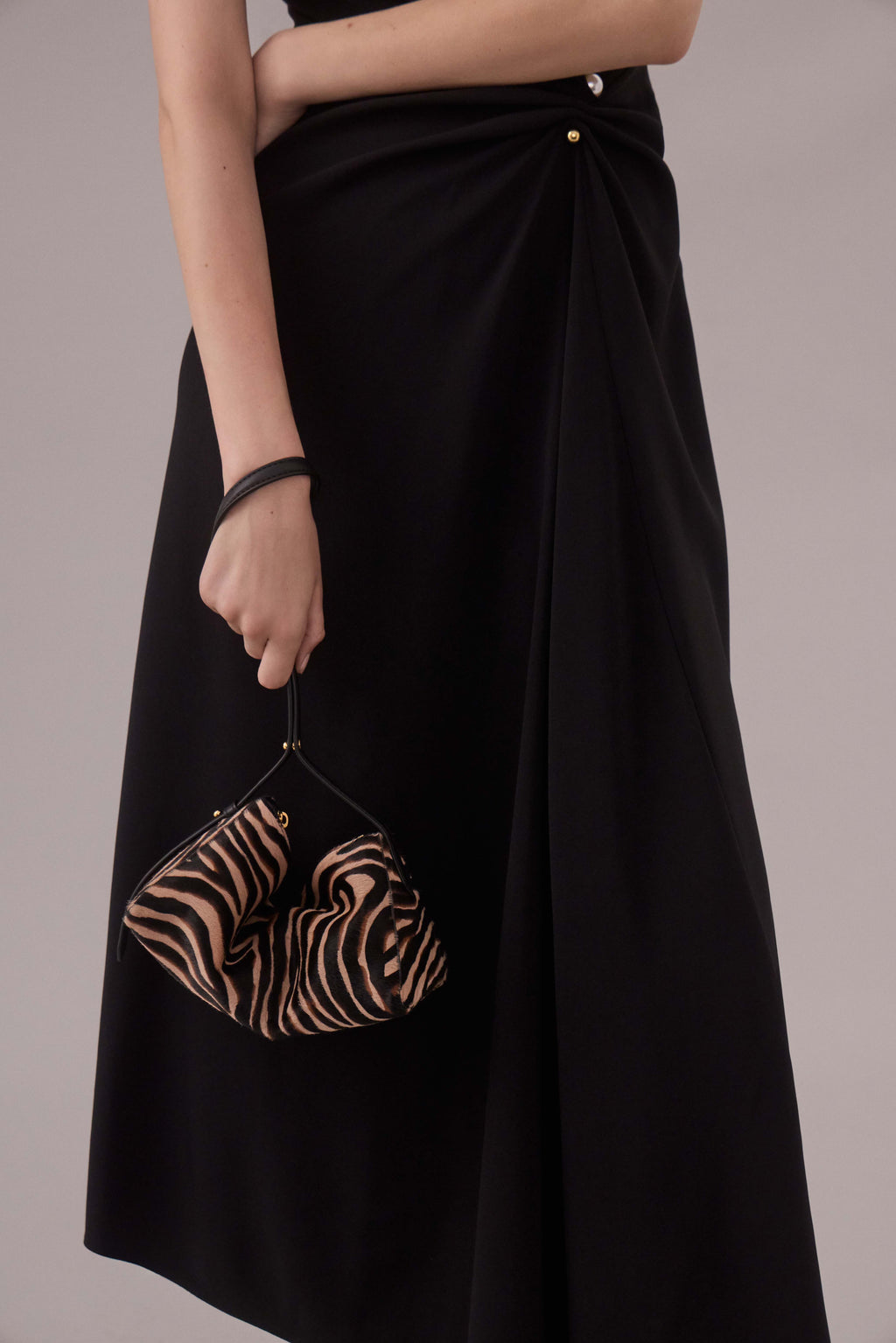 Veronica Beard Zebra print calf hair shoulder bag with gold zipper.