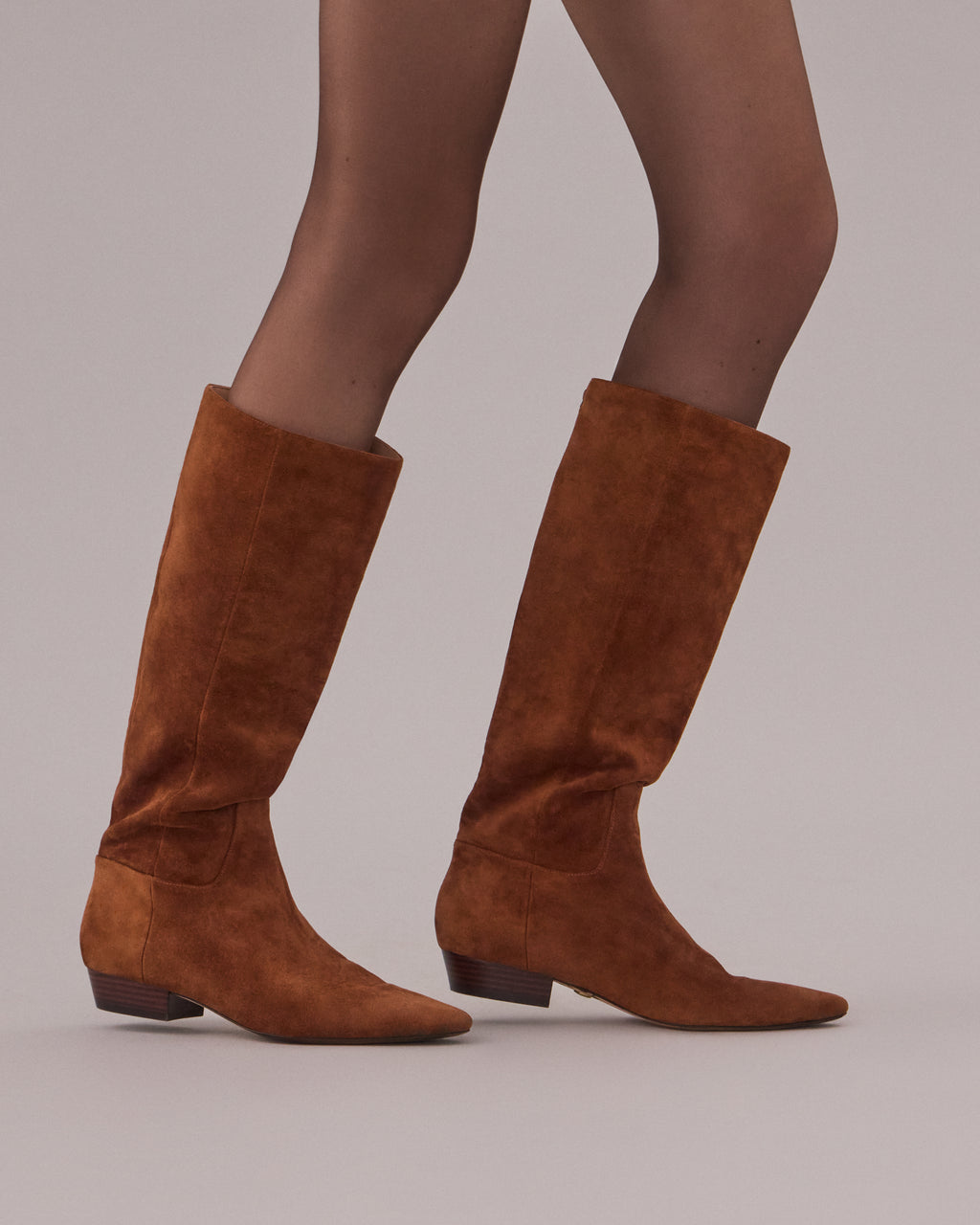 Veronica Beard Brown suede knee-high boot with pointed toe.