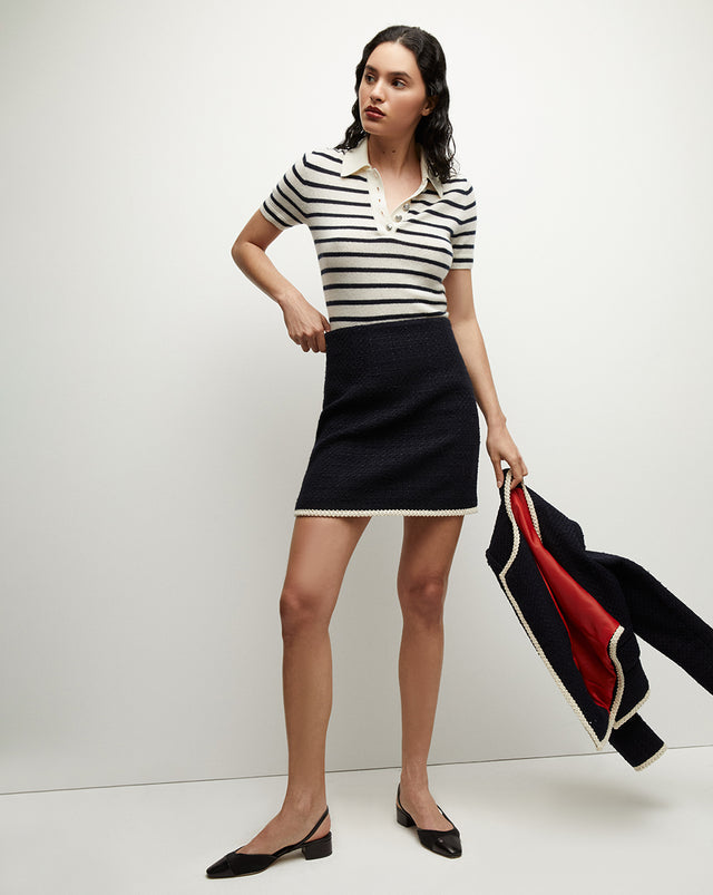 {{ outfit: 2407-roman-skirt-navy }} ## Roman Tweed Skirt