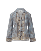 Veronica Beard Light blue patterned long-sleeve shirt with a v-neck and decorative front ties.