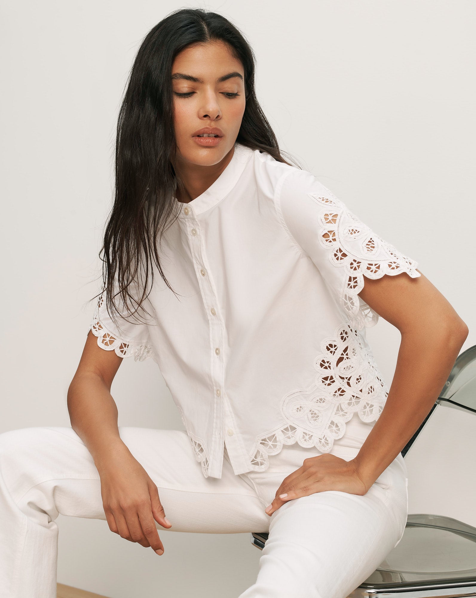 Veronica Beard White cotton short-sleeve button-up shirt with scalloped eyelet embroidery on sleeves and hem.