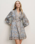 Veronica Beard Light blue floral print mini dress with a belted waist, long sleeves, and a V-neckline.