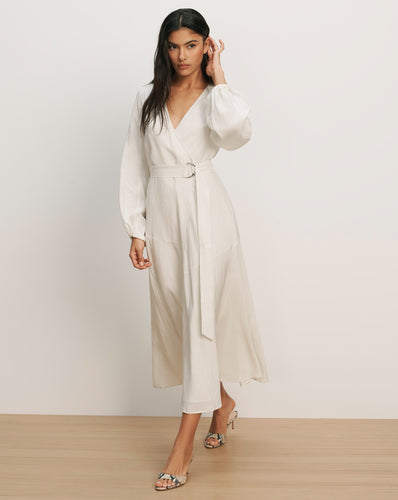 Veronica Beard Cream-colored midi wrap dress with voluminous sleeves and a matching belt.