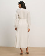 Veronica Beard Cream long-sleeve blouse with a V-neck and a matching cream midi skirt.