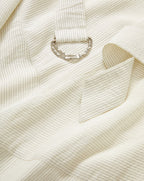 Veronica Beard Cream pinstriped cotton shirt with a silver-tone D-ring detail.
