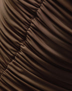 Veronica Beard Brown ruched fabric with diagonal folds.