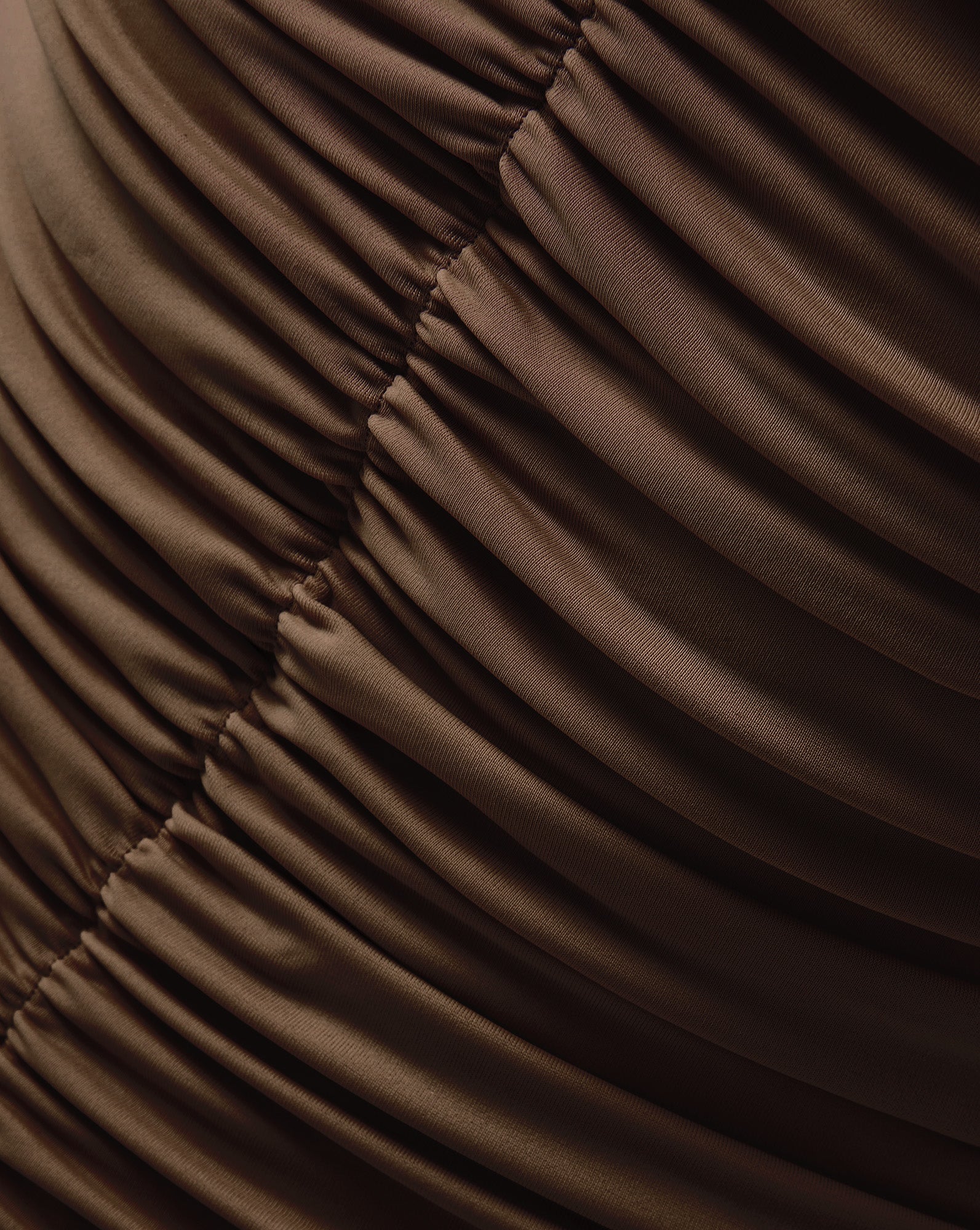 Veronica Beard Brown ruched fabric with diagonal folds.