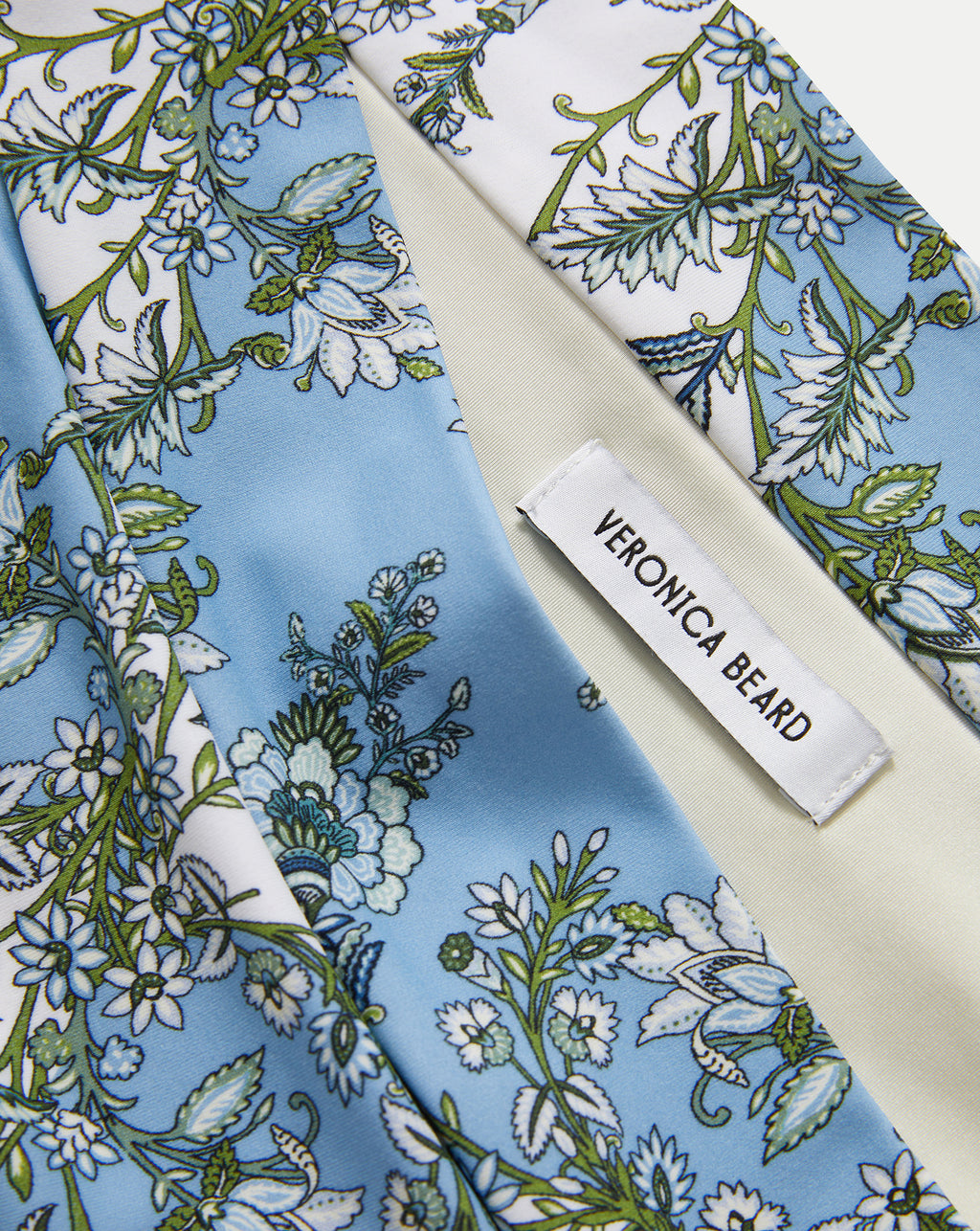 Veronica Beard Blue and white floral print silk scarf with a "VERONICA BEARD" label.