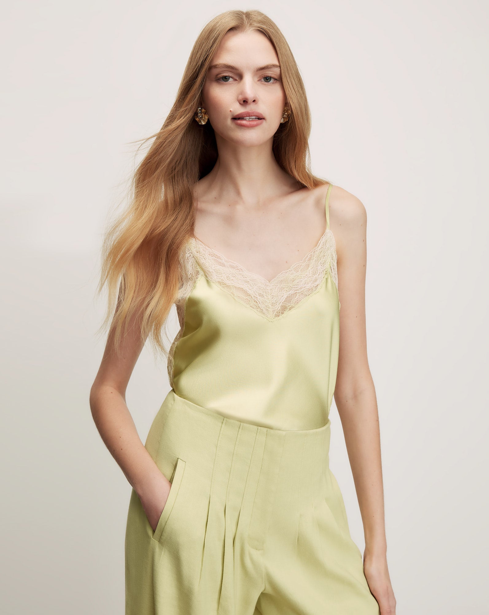 Veronica Beard Lime green silk camisole with a V-neckline and cream lace trim.