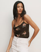 Veronica Beard Black satin camisole with a cowl neck and pink floral embroidery.