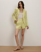 Veronica Beard Lime green linen double-breasted blazer and matching pleated shorts.