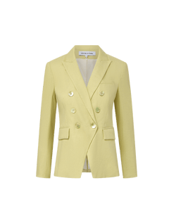 Veronica Beard Light green double-breasted blazer with peak lapels, paired with a white button-down shirt and off-white trousers.