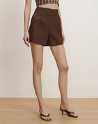 Veronica Beard Brown high-waisted linen shorts with a relaxed fit and subtle pleats.