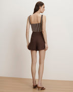 Veronica Beard Brown and white striped sleeveless crop top with brown high-waisted shorts.