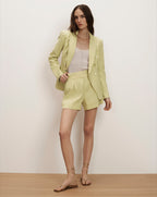 Veronica Beard Light green linen double-breasted blazer and matching pleated shorts.