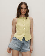 Veronica Beard Sleeveless lime green button-front vest with a rounded neckline and pointed hem.