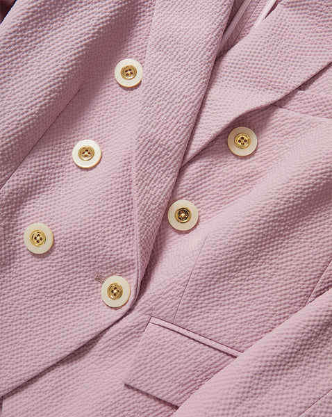 Veronica Beard Pink seersucker double-breasted blazer with cream buttons.