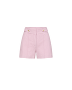 Veronica Beard Pink high-waisted shorts with gold button details.