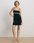Veronica Beard Black mini dress with braided straps and waist trim.