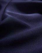 Veronica Beard Navy blue silk top, draped, with subtle sheen.