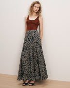 Veronica Beard Brown ribbed tank top, black paisley maxi skirt.
