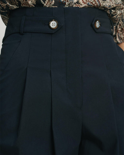 Veronica Beard Navy pleated trousers with button details.