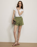 Veronica Beard Olive green pleated shorts with button details.