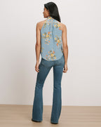 Veronica Beard Blue floral halter top and flared jeans.