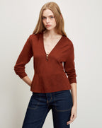 Veronica Beard Brown knit peplum sweater with V-neck and button detail.