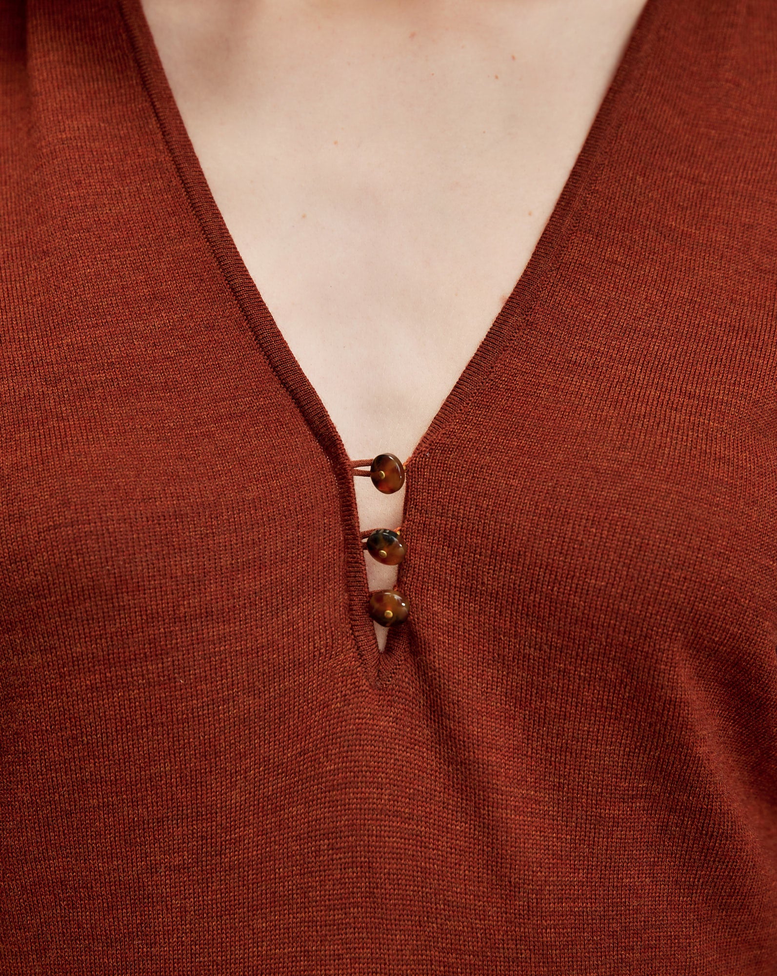 Veronica Beard Brown knit top with V-neck and three buttons.