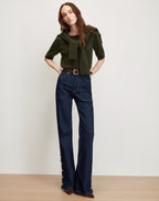 Veronica Beard Dark wash wide-leg jeans with buttoned cuffs.