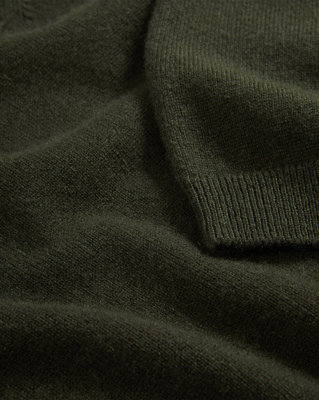 Veronica Beard Dark green knit sweater with ribbed cuff.