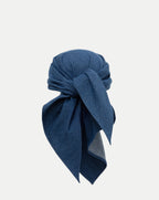 Veronica Beard Blue denim headscarf, tied in a knot.