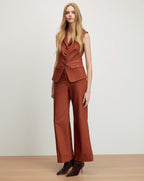Veronica Beard Rust sleeveless vest and wide-leg pants suit.